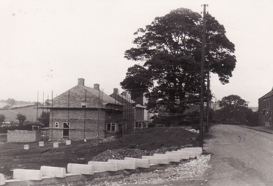 Sept. 1st 1957. These council houses being built where bomb fell opposite 31”