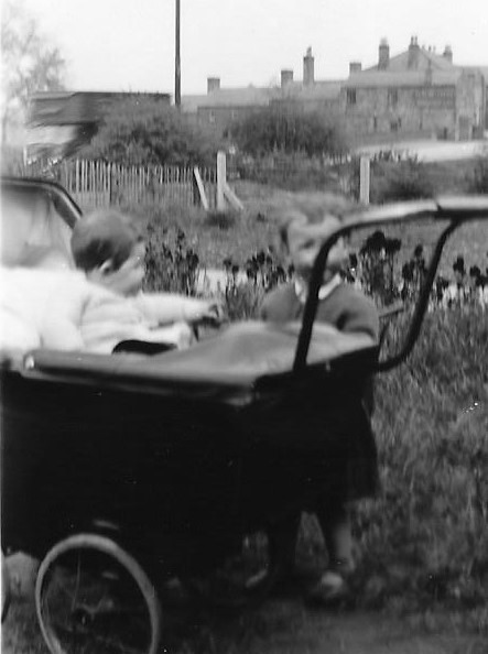 Pamela Pegg, with her cousin Graham Patfield in the pram.