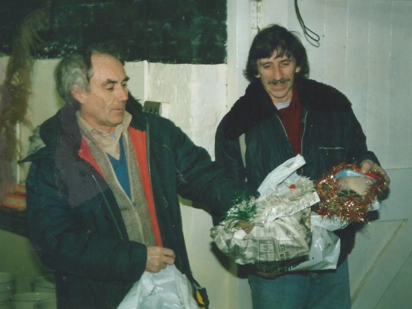 Terry Hubbard and Terry Davies receiving their Christmas chicken at Pearson's - Lesley Foulkes