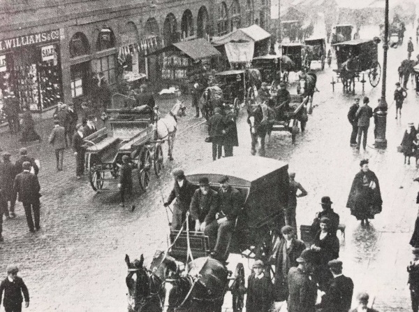 High Street in 1903 on when appears to be a market day with stalls, you can just see New Square, and the little Market Square. - Alan Taylor