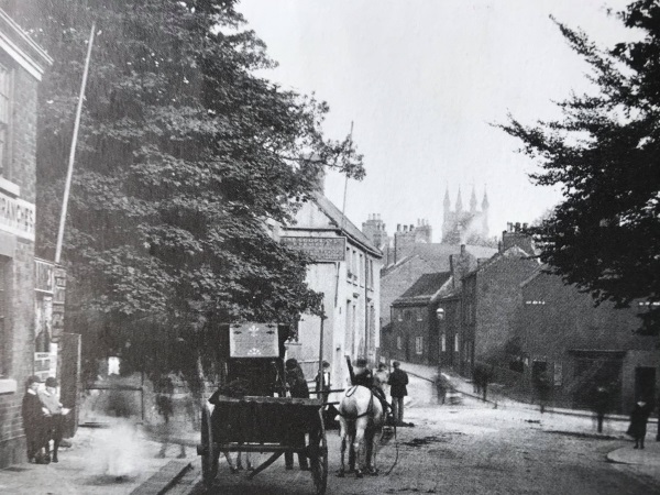 Holywell Street at the junction of Newbold Road and Sheffield Road, c. 1900. The tower of Holy Trinity Church can be seen. - Alan Taylor