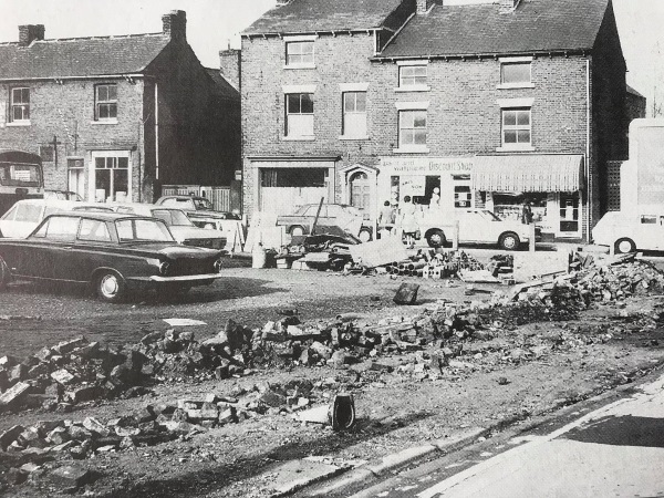 Saltergate in 1982, just after demolition of the old properties on Broad Pavement corner lately occupied by Staffordshire Farmers. The north side houses Evans Glass More, and the Red Cross.