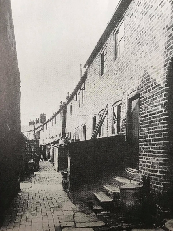 This picture is at the back of West Row, the brick-built rear of the Row, leading to the curve of Boythorpe Road.  - Alan Taylor